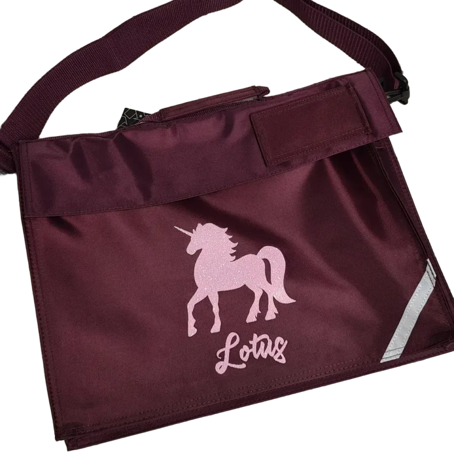 Burgundy personalised unicorn book bag with pink sparkle unicorn design and name Lolas in script font